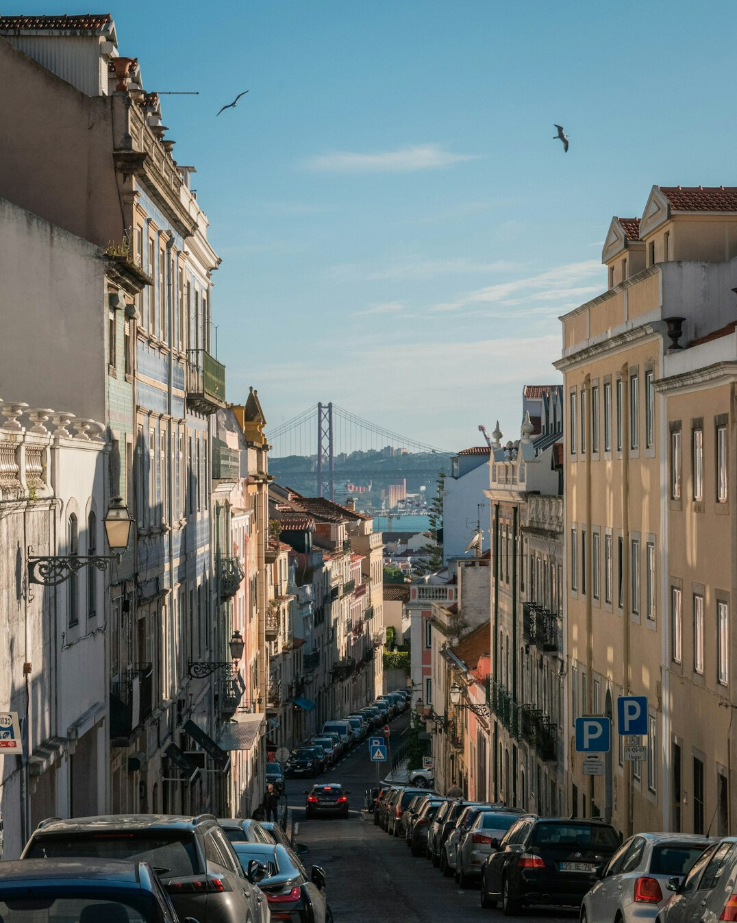 Rooftops and river view of Lisbon at golden hour